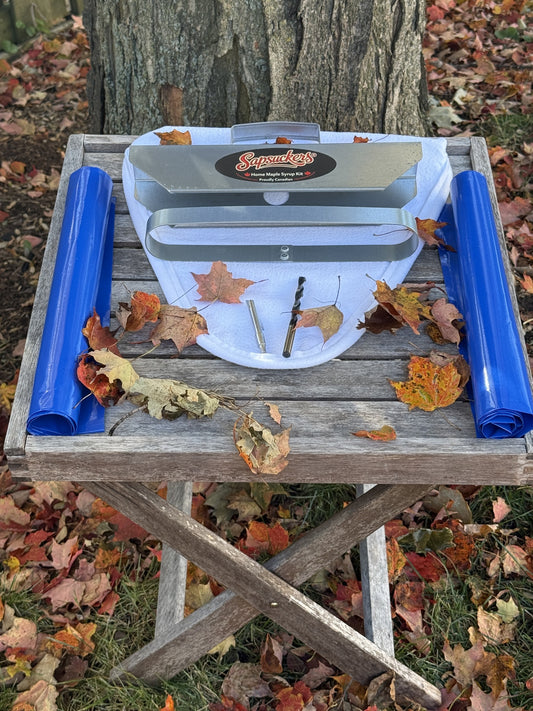 Everything in The First Tap™ kit: sap bag holder, two sap bags, reusable felt filter, aluminum spile and drill bit