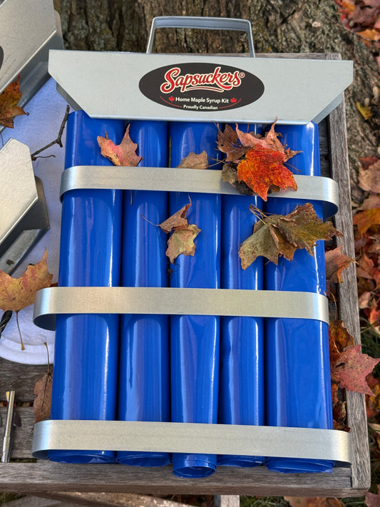 Everything in The Triple Tap™ kit: three sap bag holders, sap bags, three aluminum spiles, drill bit and reusable felt filter